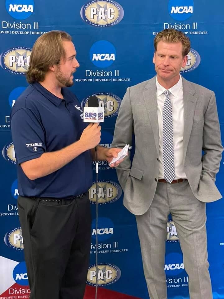WCN & Titan Radio Sports Announcer Mason Flannigan and Head Coach Scott Benzel.